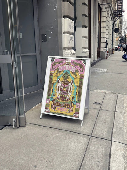 Vintage pineapple poster on street display board.